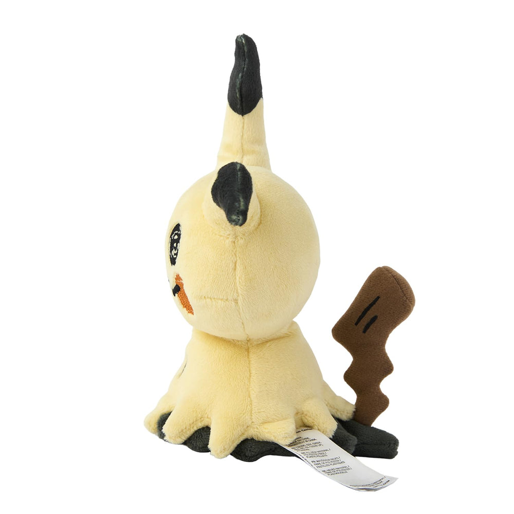 Pokémon Mimikyu plush displayed on a shelf adds whimsical charm.