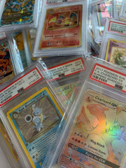 Pokémon PSA-graded card encased for display on a stand, perfect for collectors.