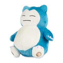 Pokémon Snorlax Sitting Cuties Plush resting upright on a desk for cute desk décor.