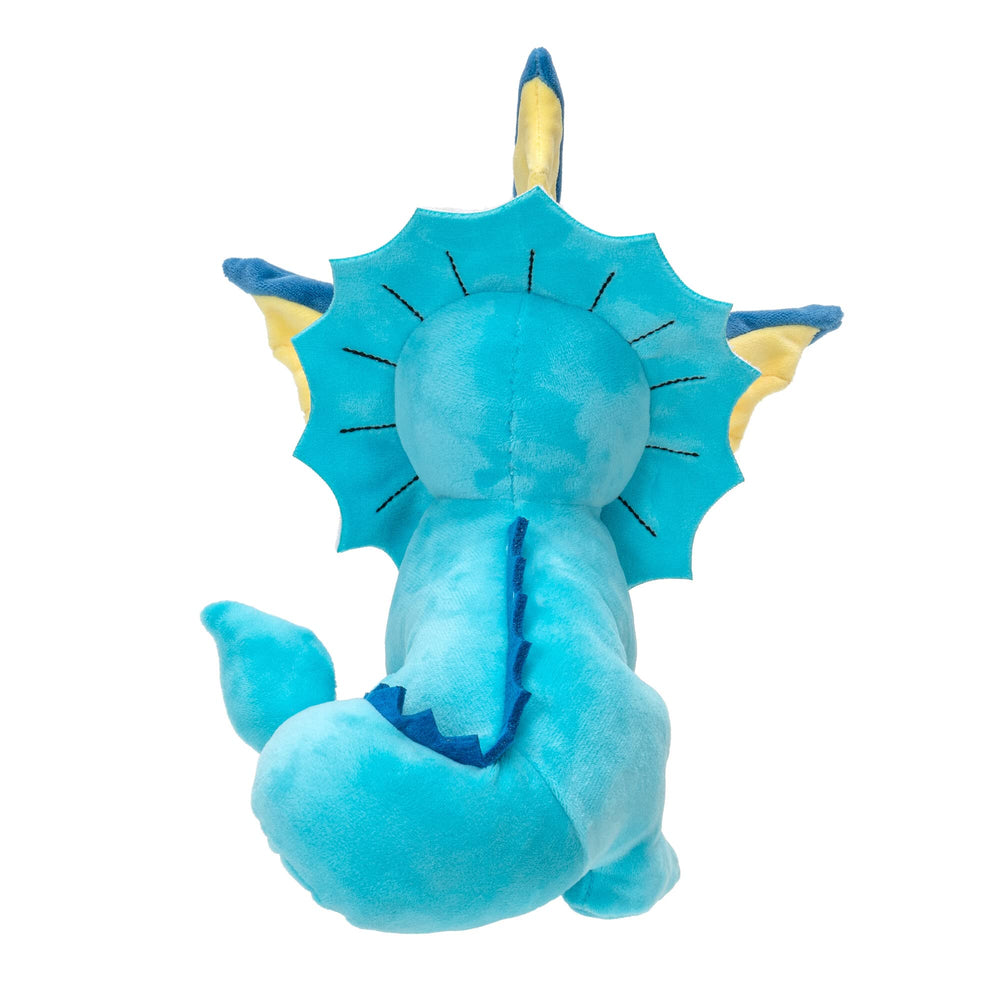 Vaporeon plush face shot highlighting eyes and stitching.