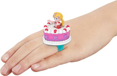Polly Pocket doll sitting inside the compact supports portable, kid-friendly adventures.