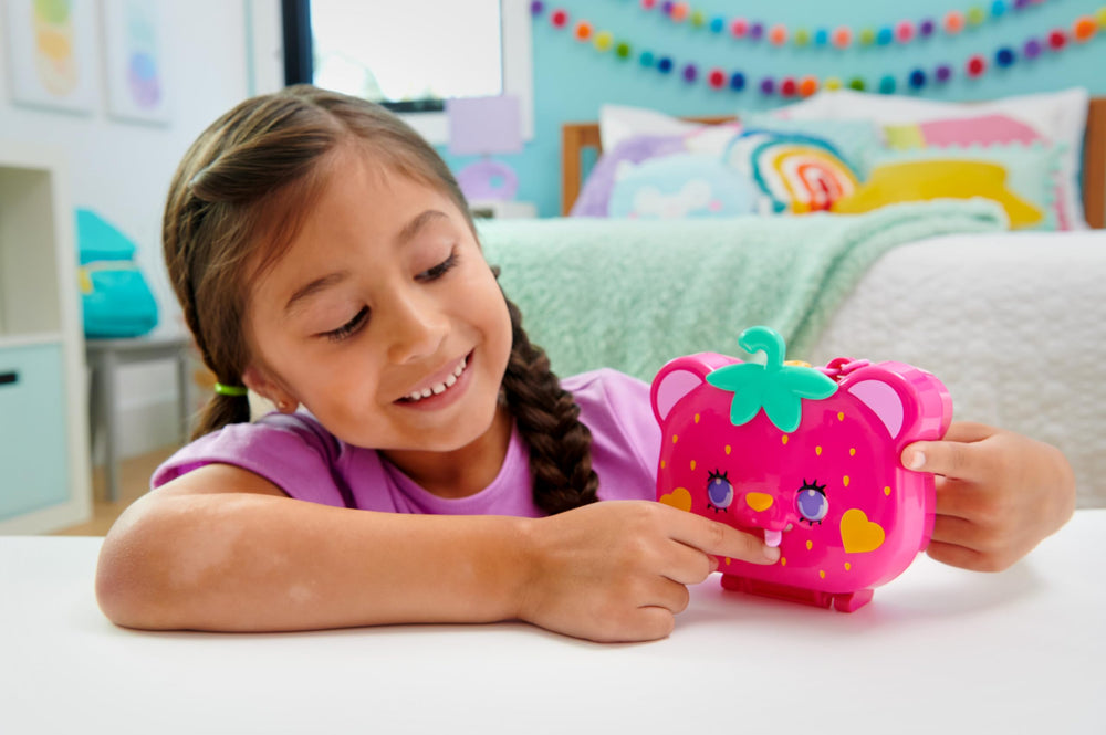 Polly Pocket two micro dolls inside the Straw-Beary Patch for imaginative storytelling.