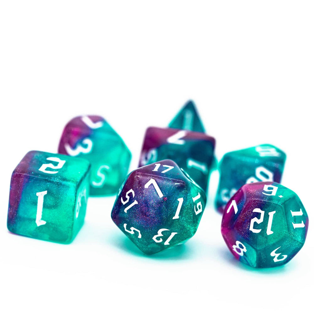 Poludie Rose Blue Glitter dice set in action during gameplay.