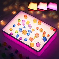 PreTrans sand painting light box with a soft glow for calm art sessions.