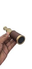 Prime NAUTICAL spyglass in use during trekking for distant landscape views