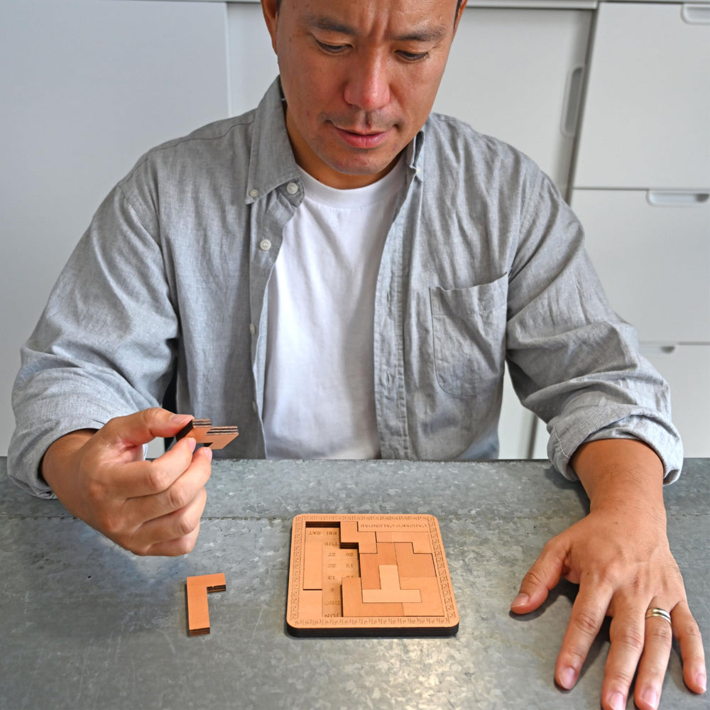 Project Genius Caesar's Calendar office desk companion for thoughtful daily puzzles.