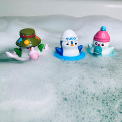 Pudgy Things penguin bobbers floating in their own floaty tubes for splashy water play.