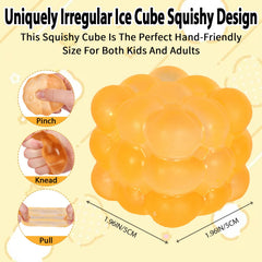 Puffwize Ice Cube Squishy Toy yellow irregular shape on desk