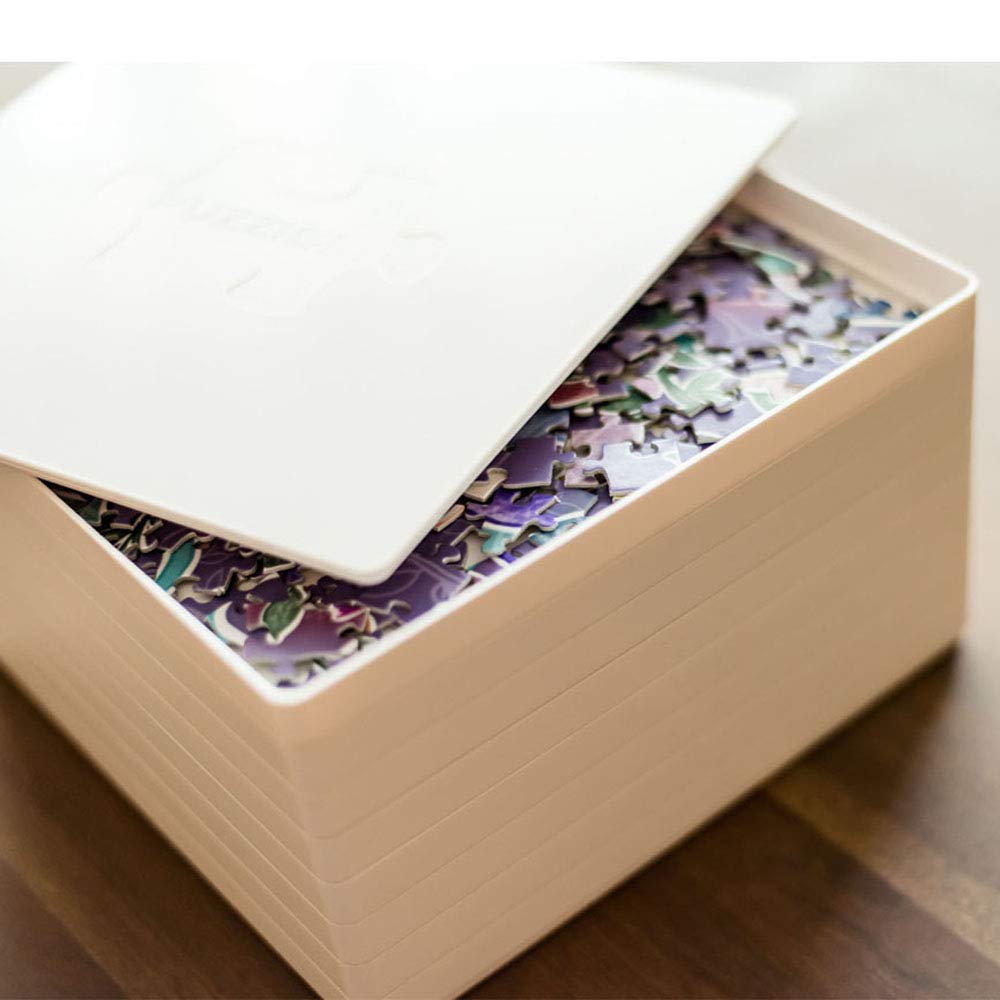 PUZZLE EZ trays with smooth bottom prevent snagging and facilitate sliding pieces.