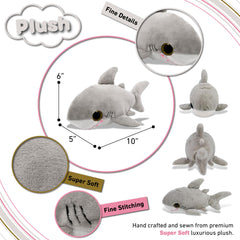 Puzzled plush shark face closeup highlights soft fabric and friendly smile.