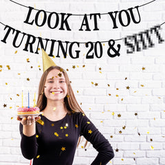 PYBHILK cheers to 20 years banner decor enhances photos.