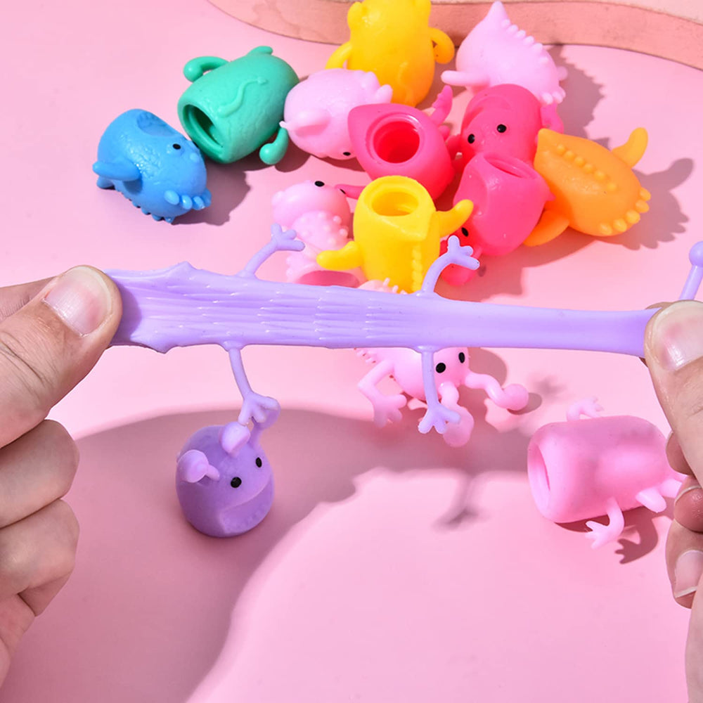 Qiuttnqn monster stretchy finger puppets in hand enabling imaginative role play and storytelling.