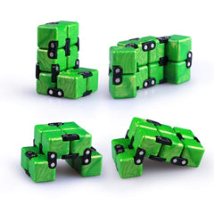 QiyI Little Golden Elephant infinity cube on desk, a discreet stress-relief companion.