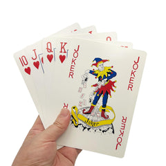 QkonkgnS poker night giant cards on table ready for big-hand entertainment.
