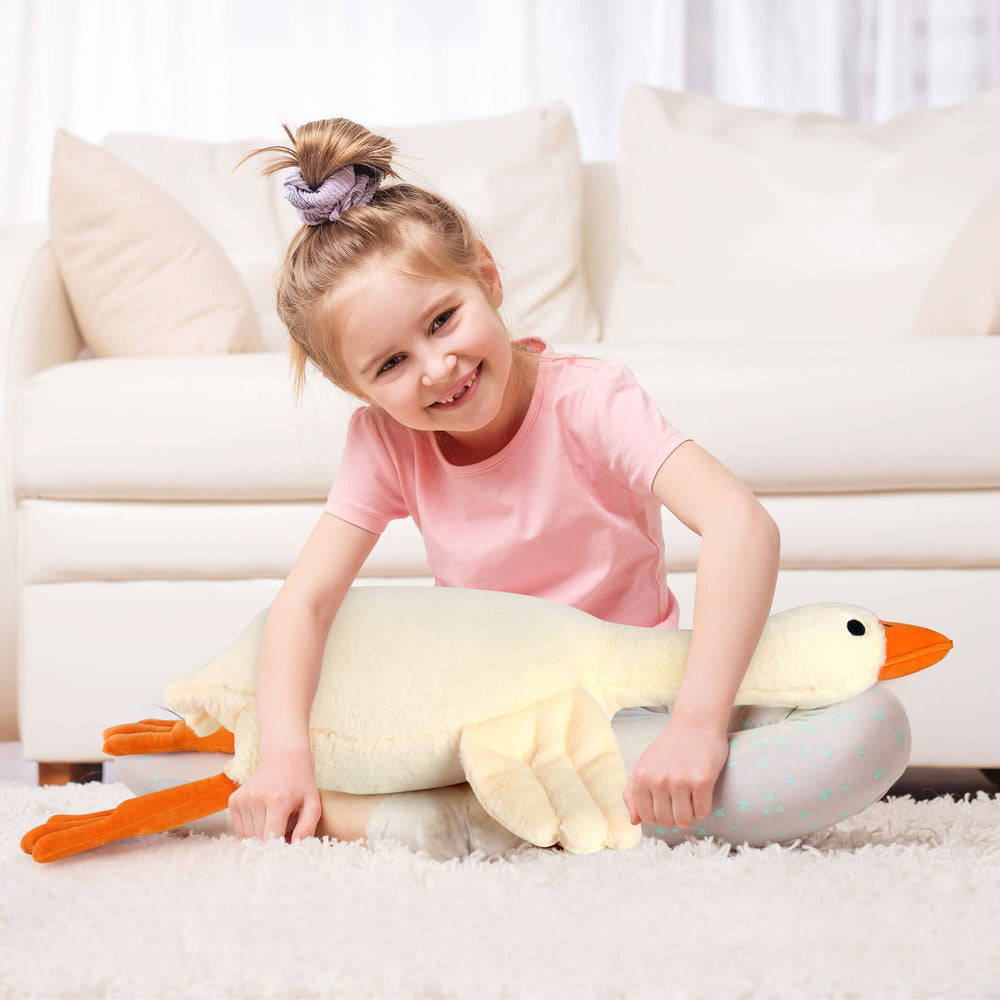 Qpewep goose plush used as a cozy decor accent in living spaces.