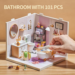 Qudify miniature toilet and accessories create realistic bathroom setups.