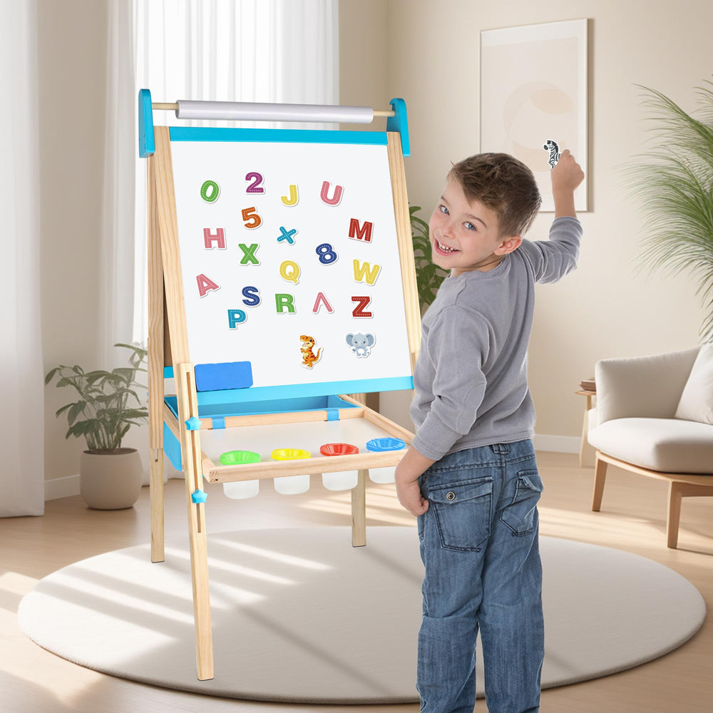 Ranqibo kid using easel outdoors enjoying creative learning in fresh air.