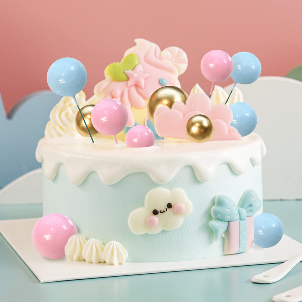 RASSLISA ball cake topper on a wedding dessert table adding whimsical color