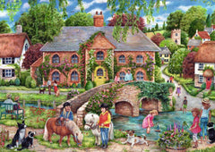 Ravensburger Village Life shows a stone bridge over a river, perfect for collaborative play.