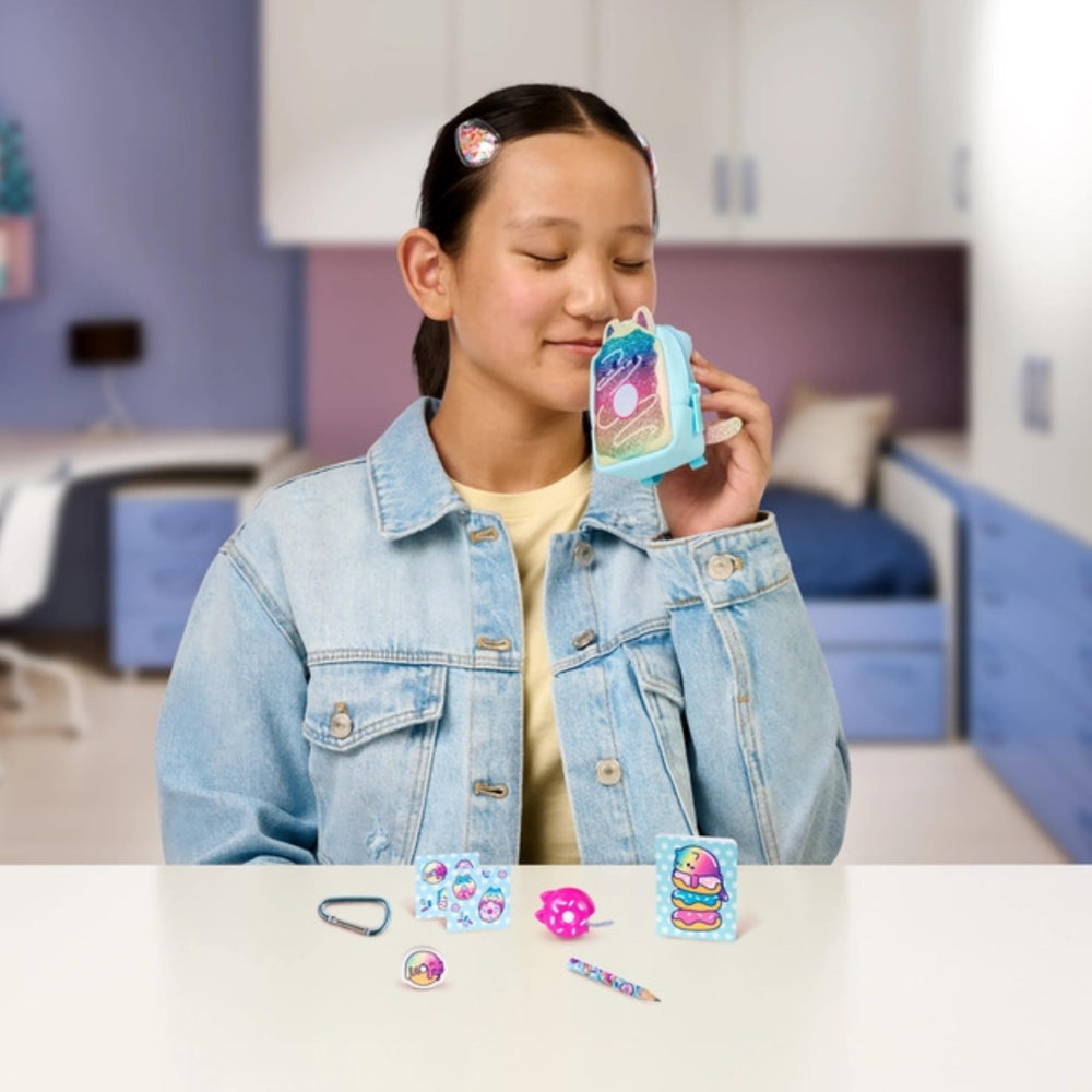 REAL LITTLES Meow Meow Donut backpack features scented micro surprises.