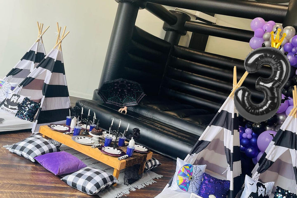 Large 11-number decorations set up in a party scene for photos.