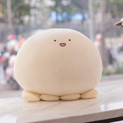 REFAHB plush toy in a bed decor setting adding playful charm