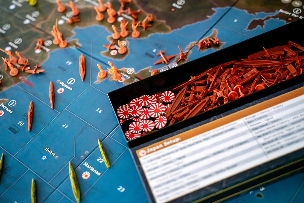 Renegade Axis & Allies 1940 Pacific game-night—family and friends enjoy social strategy.