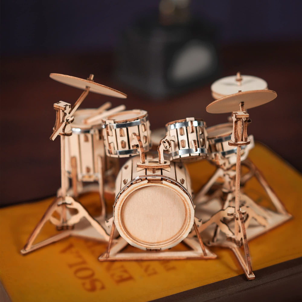 Robotime drum kit assembly in progress, boosting patience and fine motor skills
