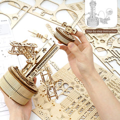 ROKR airplane tower music box parts kit shows laser-cut sheets and pre-cut pieces