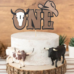 Rweseo Cow-themed birthday decor on cake adds color