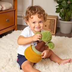 Ryttir flower plush on a desk brightens workspace and decor.