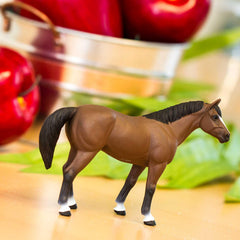 Safari Ltd. American Quarter Horse Gelding figurine side profile for breed study.