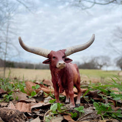 Safari Ltd Watusi Bull figurine shows realistic reddish-brown body for lifelike storytelling.