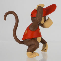 Sanei FCM-032 Diddy Kong on desk display with other collectibles.
