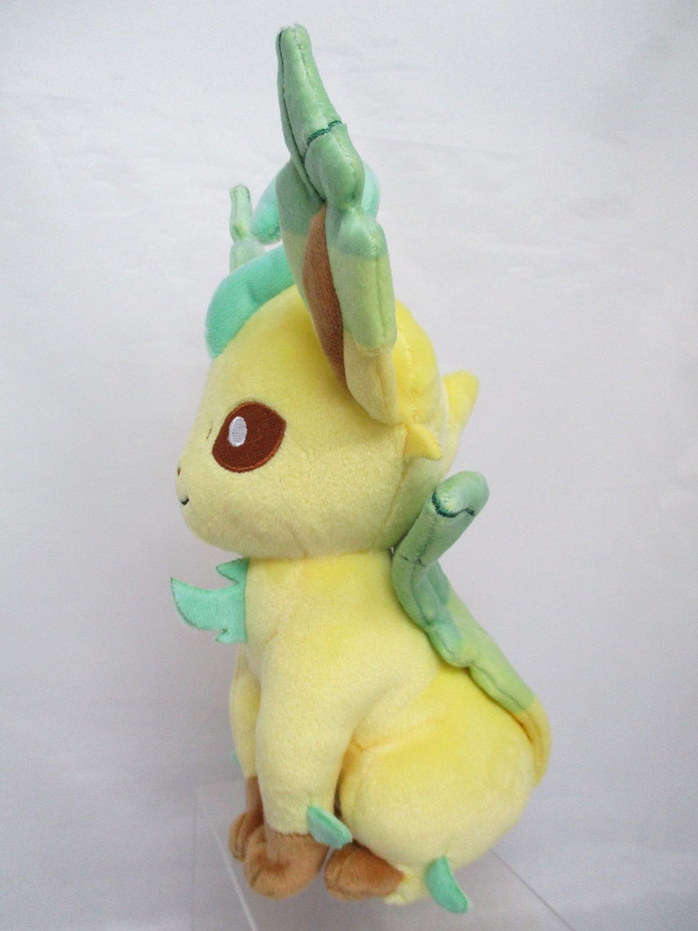 Sanei Leafeon plush head close-up, vivid embroidery and cute details.