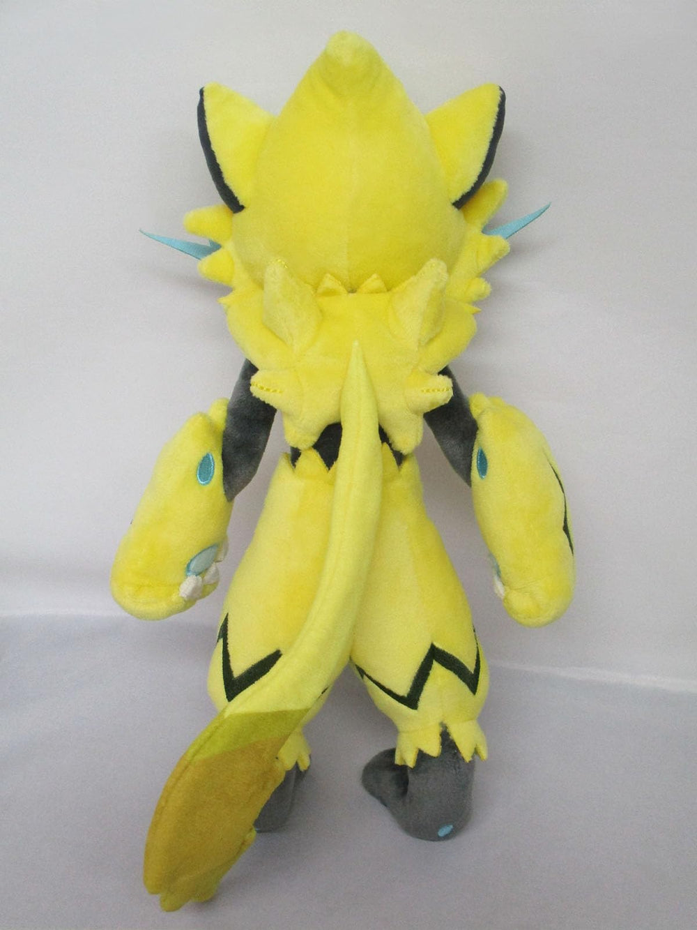 Sanei Zeraora 11-inch plush, back view, shows plush texture and craftsmanship