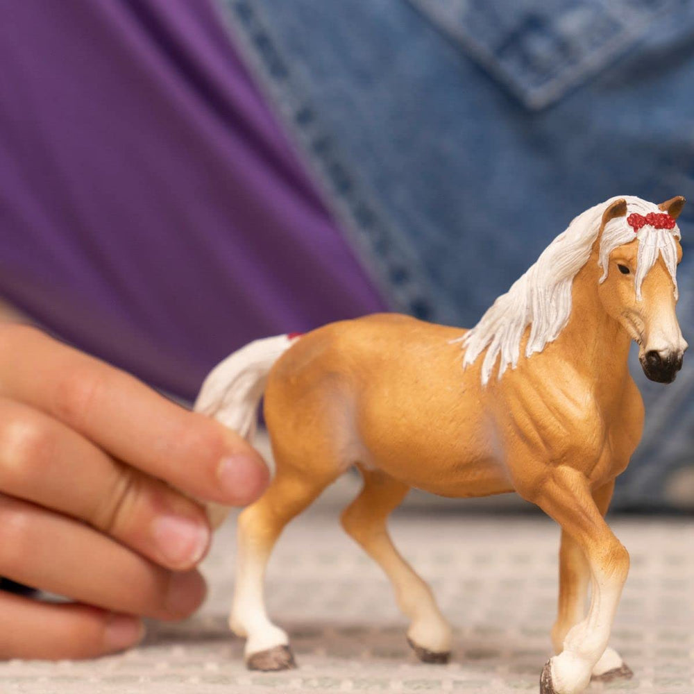 Schleich Haflinger mare with flowing mane, ideal for storytelling