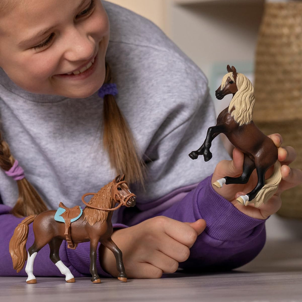 Schleich Peruvian stallion toy in a playful scene to spark adventures