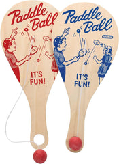 Schylling Paddle Ball shown at the beach or park for portable play.