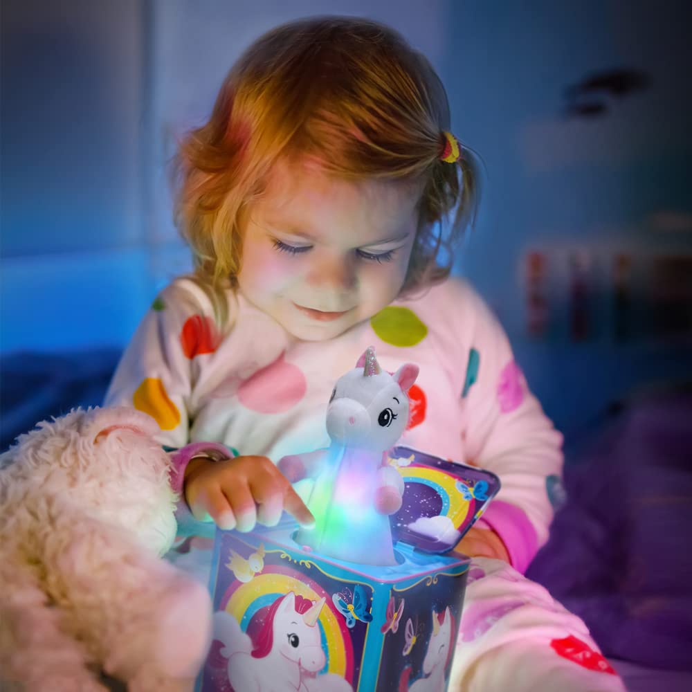 Schylling unicorn plush opens with music and a rainbow glow for joyful play.