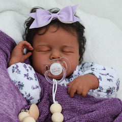 SCOM Reborn doll closeup showing infant-grade clothing with soft touch.
