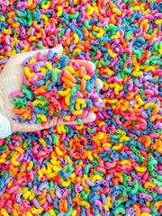 Close-up of Sensory-N-Stuff rainbow elbow pasta showing vivid colors for play.