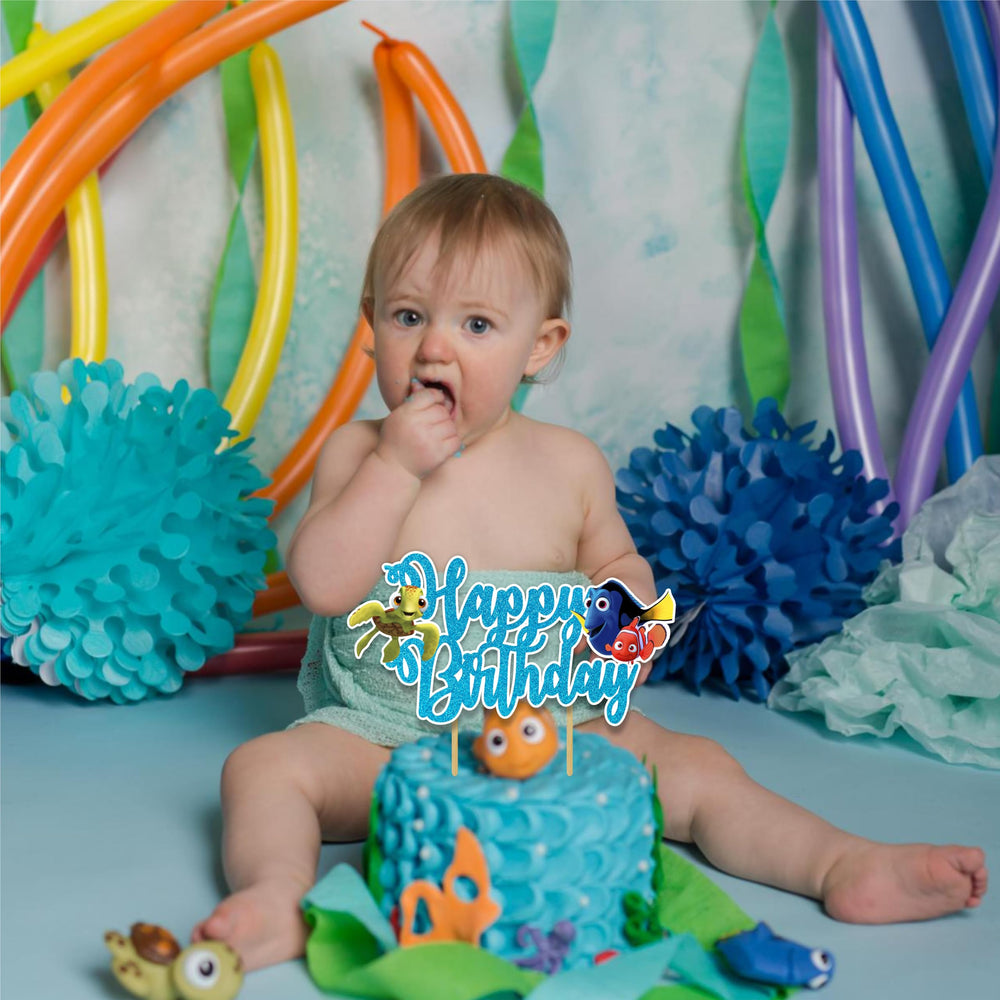 Seyal Findng Nmo topper in vibrant colors enhances ocean-themed cake designs.