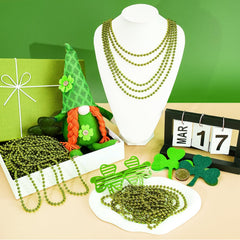 SHAOQINLIN wearing green bead necklace complements outfits at parties.