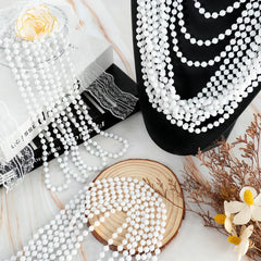 SHAOQINLIN white bead necklaces worn by model for parade throws.