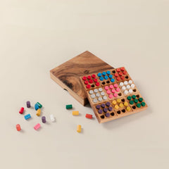 Handcrafted monkeypod wood case showcasing sustainable puzzle craftsmanship
