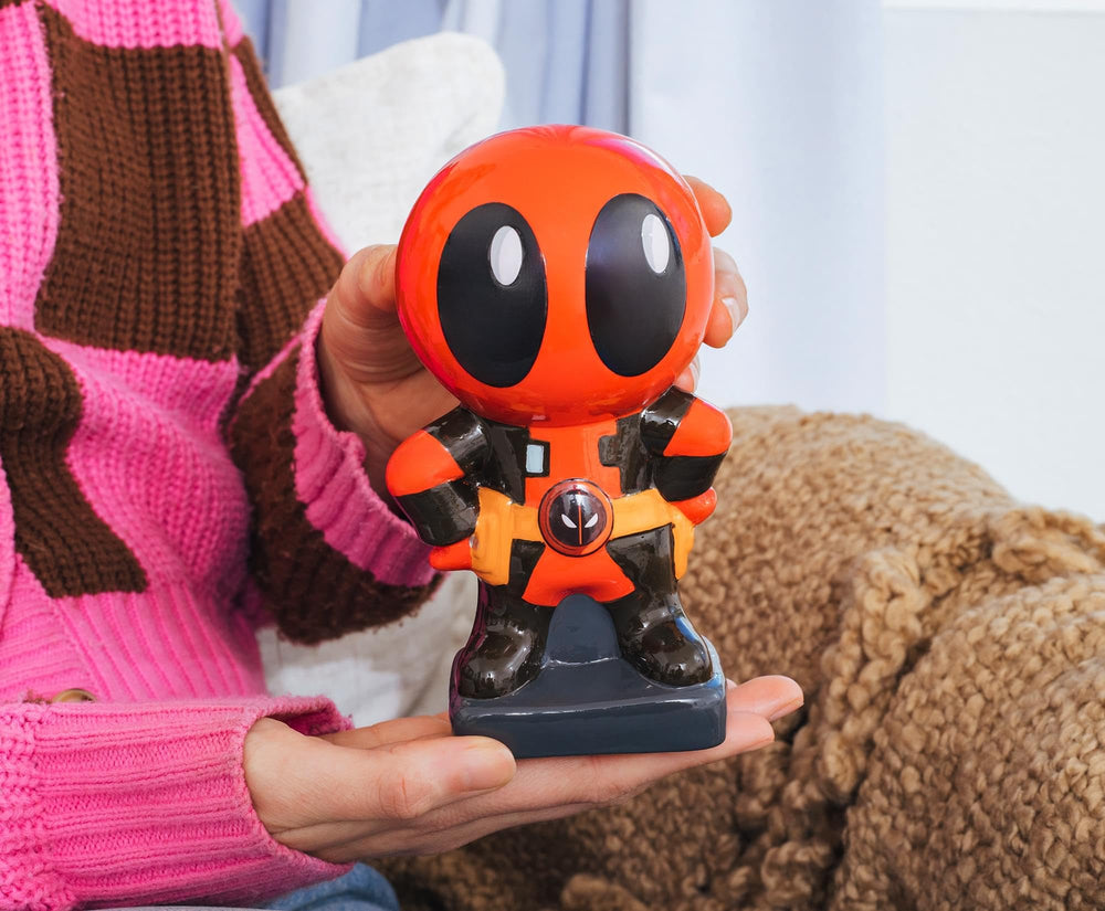 Silver Buffalo Deadpool Chibi Stance with coin-stacking demonstration.