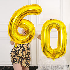 SINBEE Gold foil balloons with holes for simple threading and display.