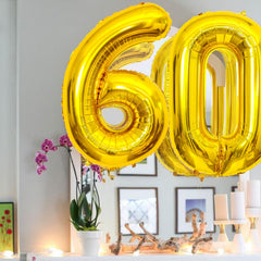 SINBEE Gold party decor shines as a backdrop during celebrations.
