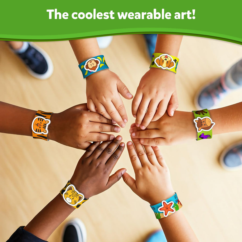 Kids showing off wearable art made with Skillmatics Snap Bandz